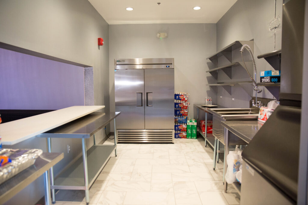 Prep Kitchen Equipped With Ice Machines, Commercial Grade Large Stainless Steel Refrigerators, Stainless Steel Shelves & Tables, Commercial Grade Dishwashing Sink With Extendable Spray Nozzle for easy Cleaning, Tile Floors with inlaid Drainage System.