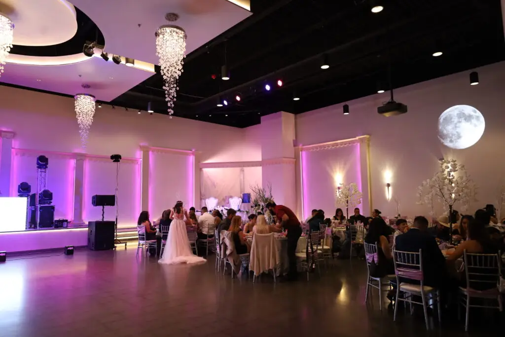 Projector Casting a Stunning Moon on the Banquet Hall Wall - Elegant Event Lighting