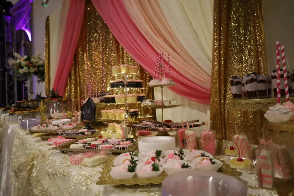 Elegant fruit and dessert table with an array of fresh fruits, pastries, and sweet treats, beautifully arranged for events and celebrations