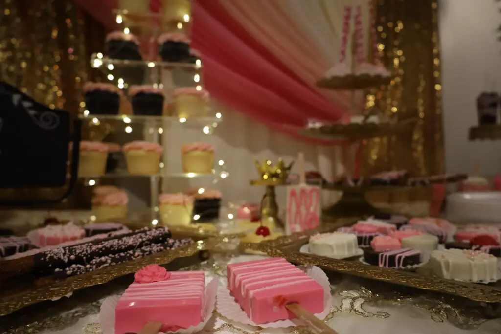 Elegant fruit and dessert table with an array of fresh fruits, pastries, and sweet treats, beautifully arranged for events and celebrations