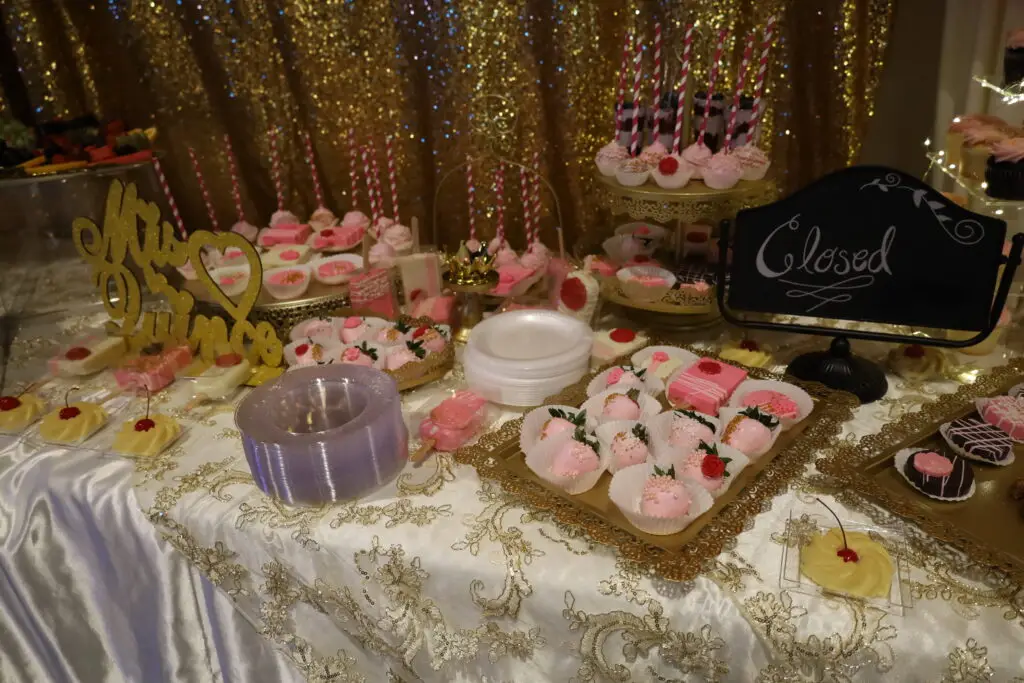 Elegant fruit and dessert table with an array of fresh fruits, pastries, and sweet treats, beautifully arranged for events and celebrations