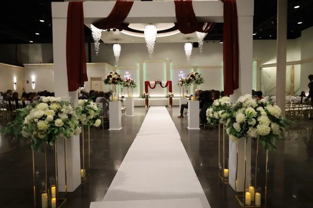 Beautifully decorated wedding ceremony setup in a ballroom at DFW Celebrations, featuring elegant decor and seating arrangements. Perfect for private events in a premier event venue and banquet hall.